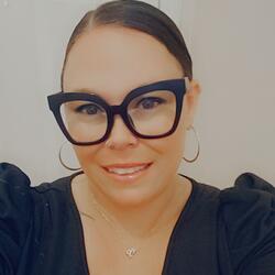 Shellee Stewart, Assistant Director of CHASS F1RST at UC Riverside, wearning a black shirt while smiling